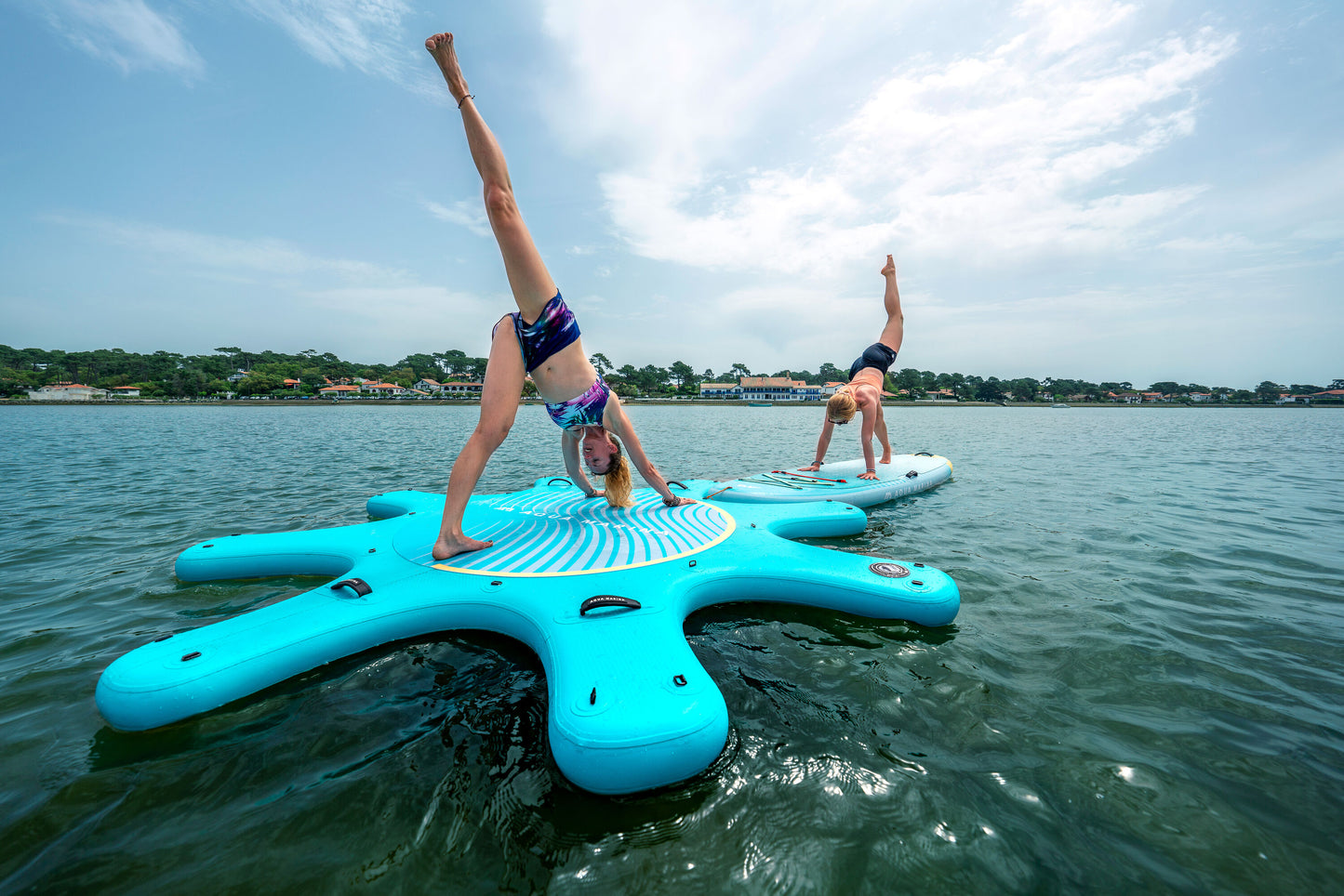Instructor leading floating yoga class on paddleboards in Montana – Book at MontanaBoardingSchool.com.