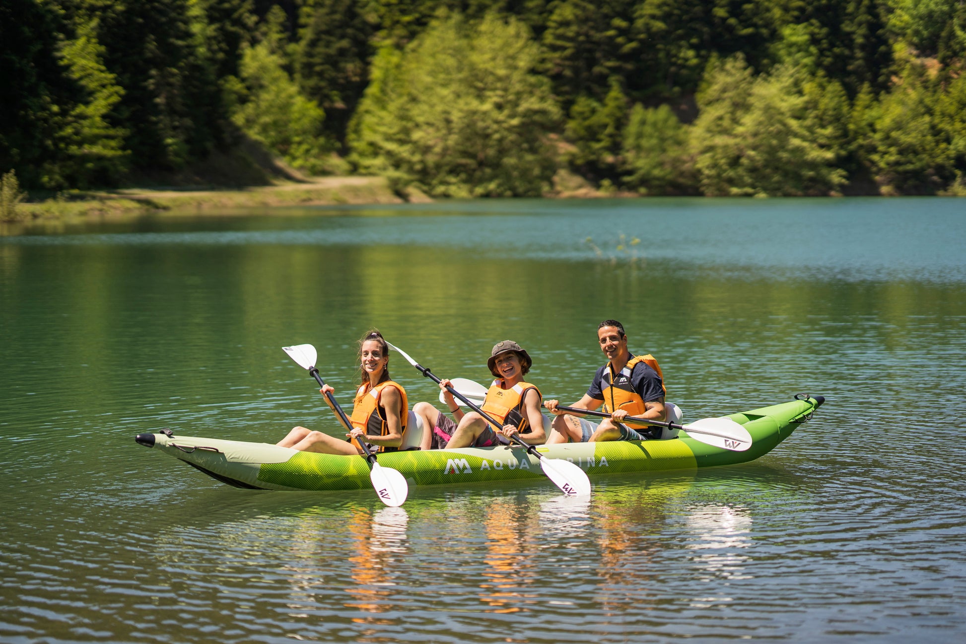 Three kayakers in lessons at MontanaBoardingSchool.com private kayak sessions. Rent from MTBoarders or buy from eboarders.