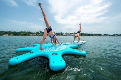 Instructor leading floating yoga class on paddleboards in Montana – Book at MontanaBoardingSchool.com. 